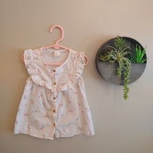 H&M white sleeveless button up blouse with ruffle detail and floral print